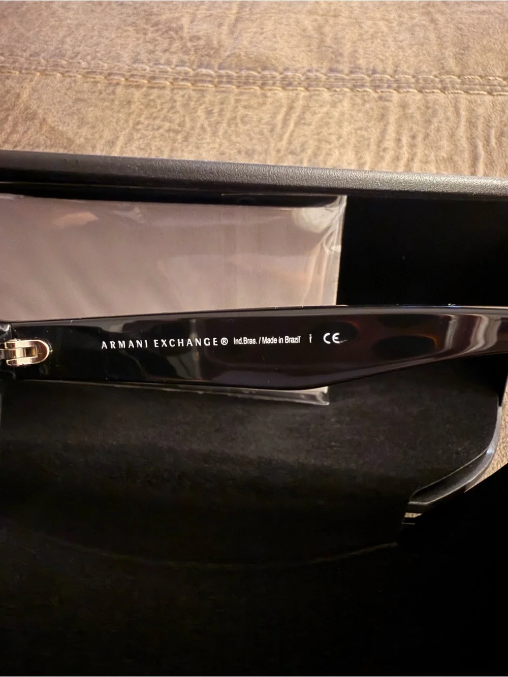 Armani Exchange Black Cat-Eye Sunglasses with Red Logo Accent